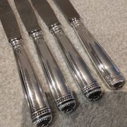 4 table knives with silver-plated metal handles, silversmith Christofle Malmaison