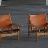 Pair of oak and leather hunting chairs by Kurt Østervig, modern Danish style from the 1960s.