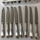 8 silver metal table knives Ercuis Lauriers
