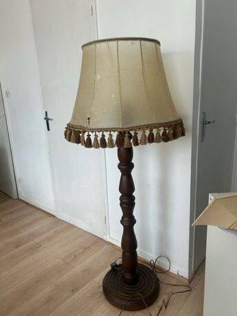 Large vintage wooden floor lamp with parchment shade and pendants.