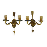 Pair of double-light Empire style arrow wall lights in bronze. Early 20th century