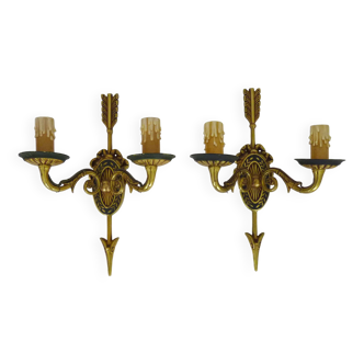 Pair of double-light Empire style arrow wall lights in bronze. Early 20th century