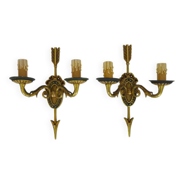 Pair of double-light Empire style arrow wall lights in bronze. Early 20th century