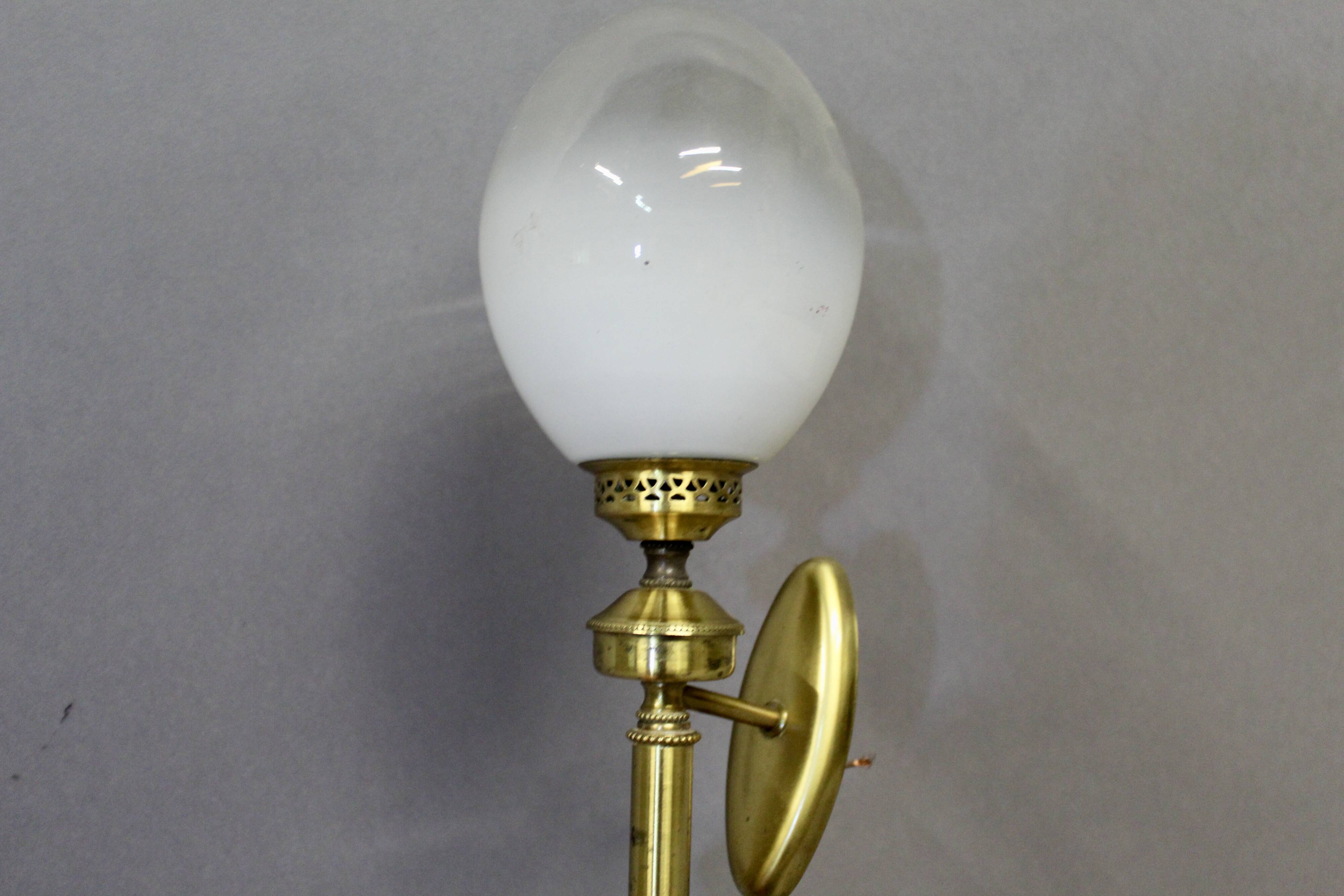 Pair of brass torchiere-style wall lights