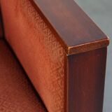 Art Deco design armchair with red fabric upholstery and wooden details