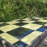 Coffee table with tiled and wrought iron finish