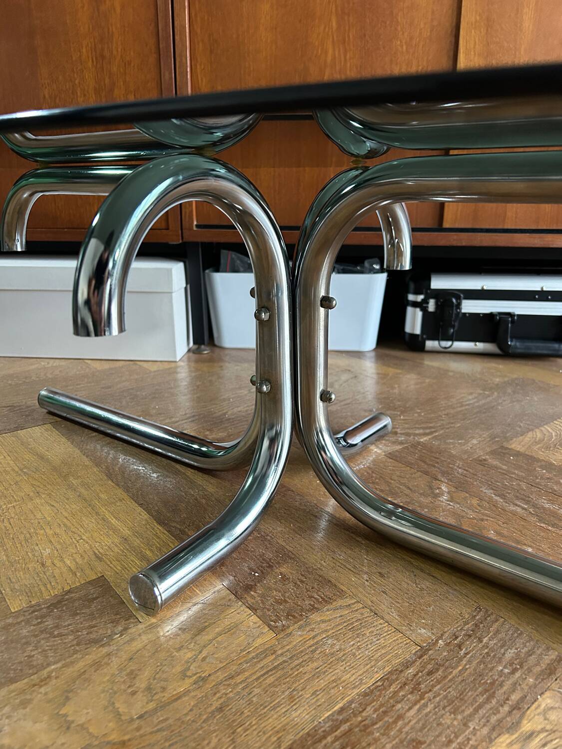 70s design oval coffee table in smoked black glass with chrome legs.