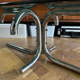 70s design oval coffee table in smoked black glass with chrome legs.