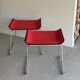 Pair of minimalist stools in red fabric with chrome legs