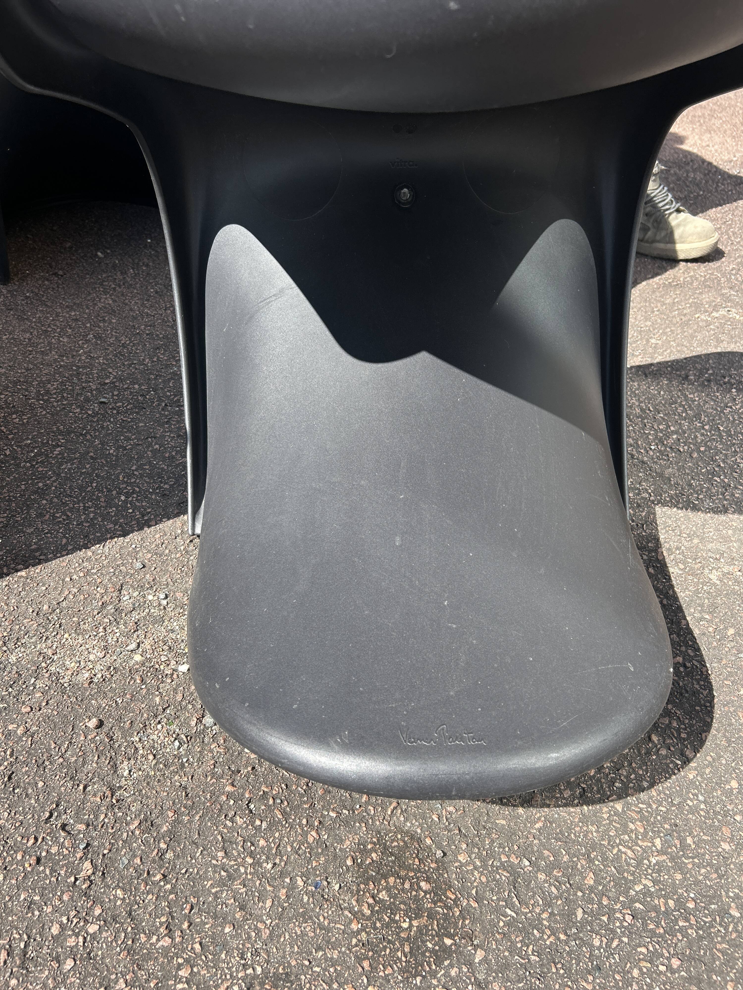 Set of 4 black Verner Panton Vitra chairs.
