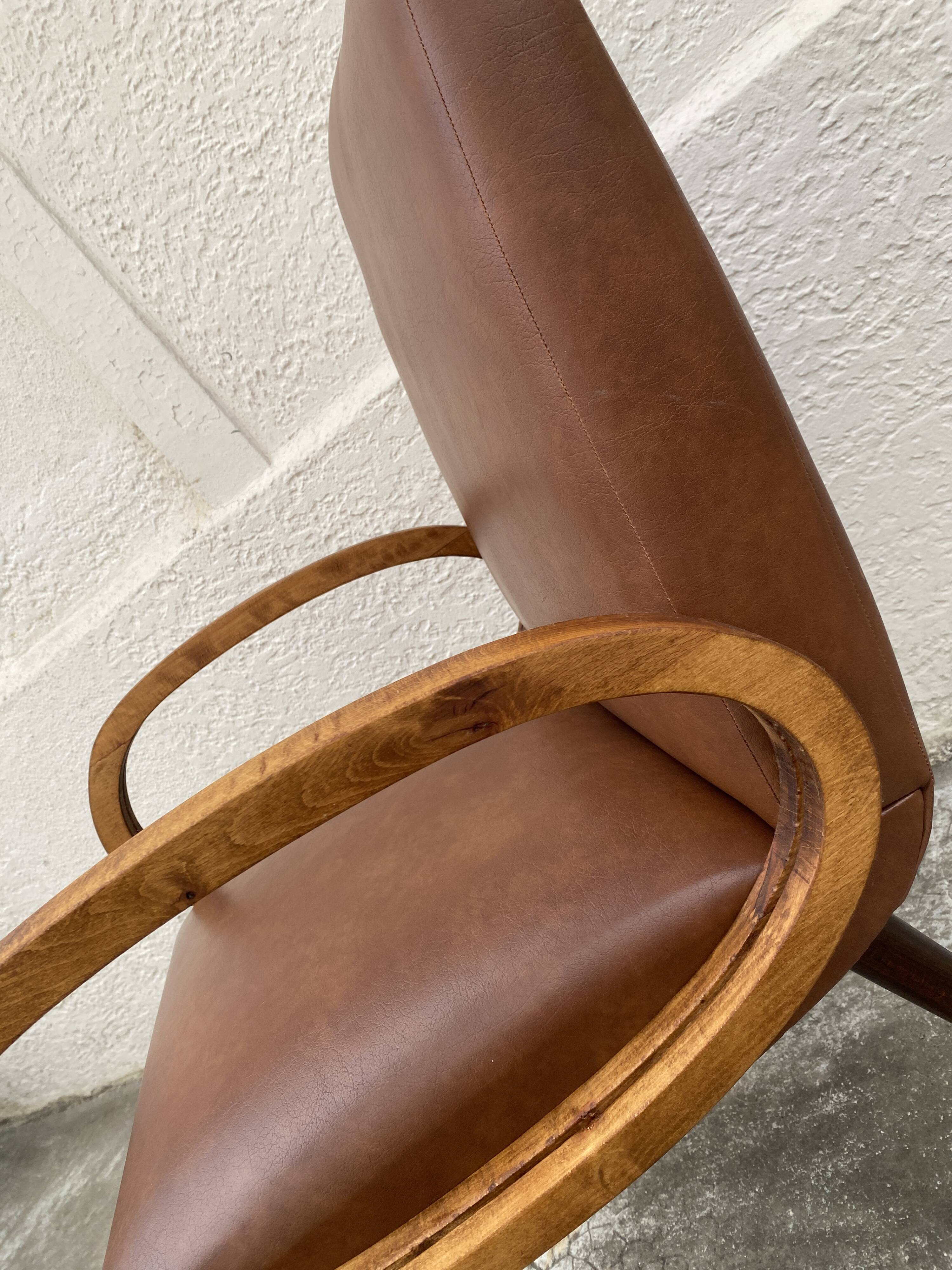 Mid-Century Scandinavian vintage retro armchair with oval armrests.