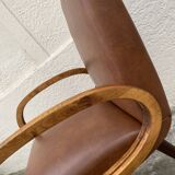 Mid-Century Scandinavian vintage retro armchair with oval armrests.