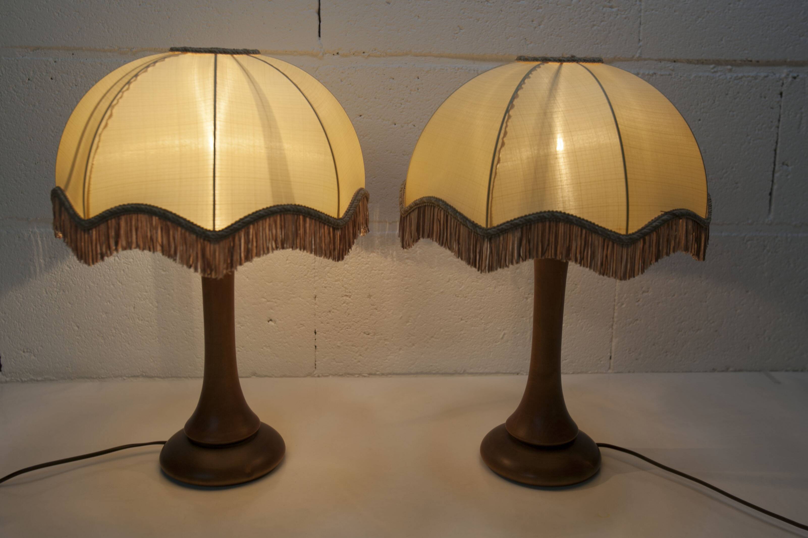 Pair of 1930s Art Deco bedside lamps with fringes, solid wood legs 52cm