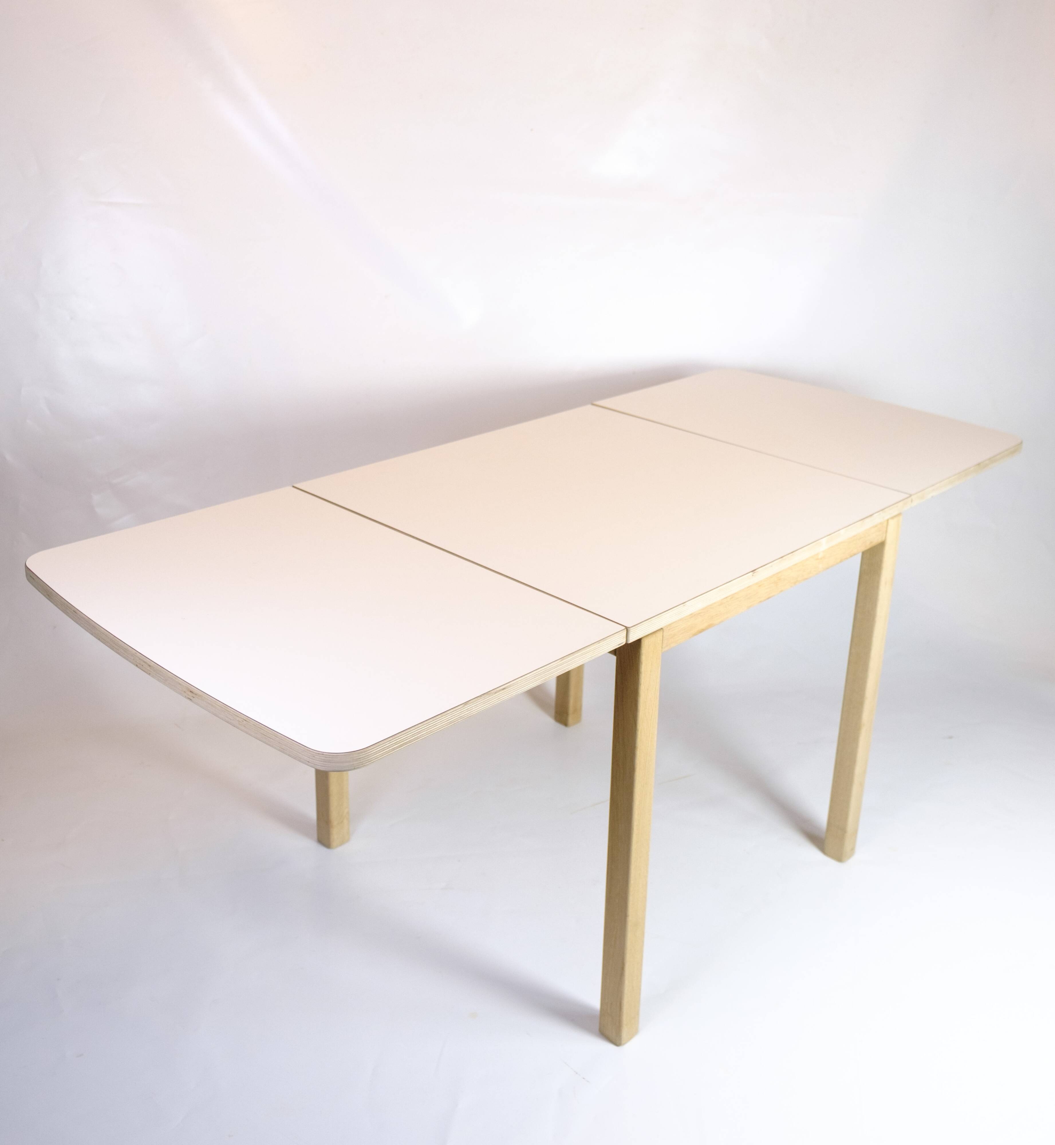 Table with drop leaves - Model 517 - White laminate top - Oak - Haslev Møbelsnedkeri