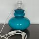 Blue opaline table lamp and vintage Maori fabric