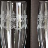 2 crystal champagne flutes of engraved arches