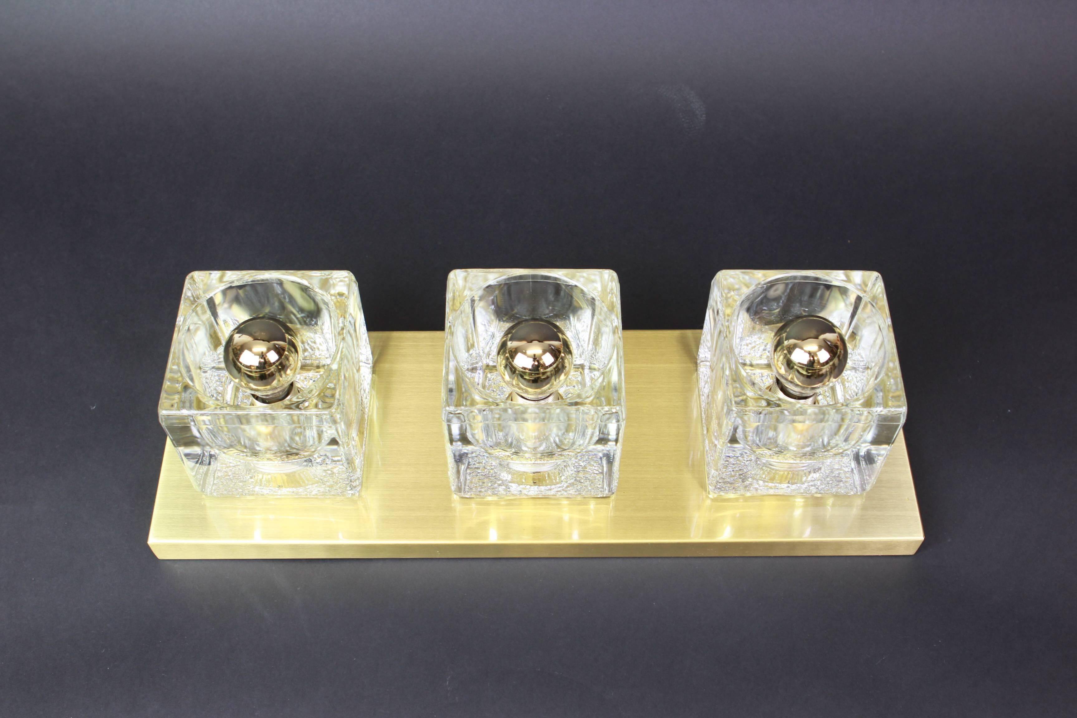 Exclusive wall sconces in crystal and brass by Peill & Putzler, Germany.