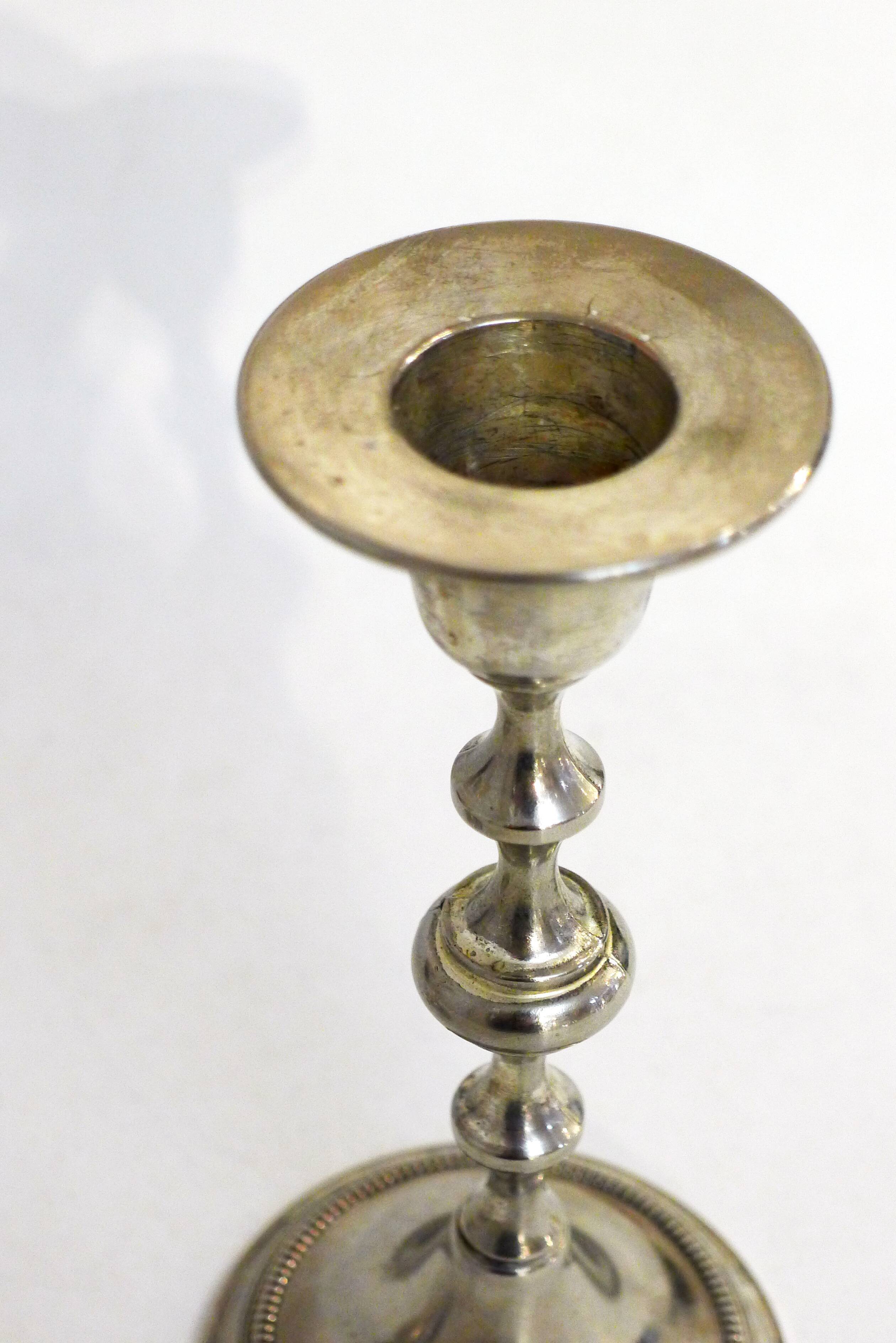Pair of metal candle holders