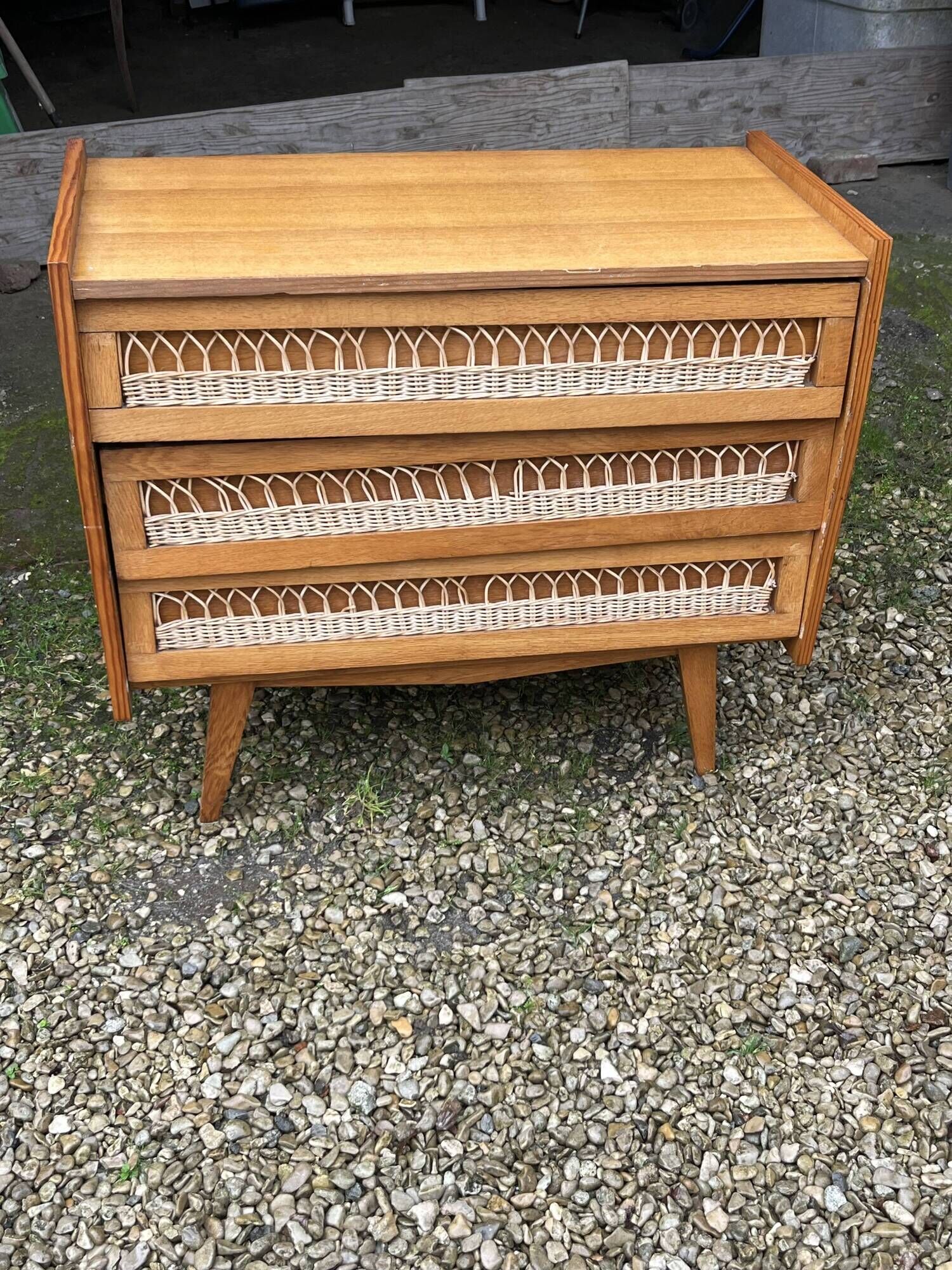 Rattan chest of drawers with tapered legs