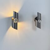 Pair of vintage wall lights, curved patinated steel, France, 1970.