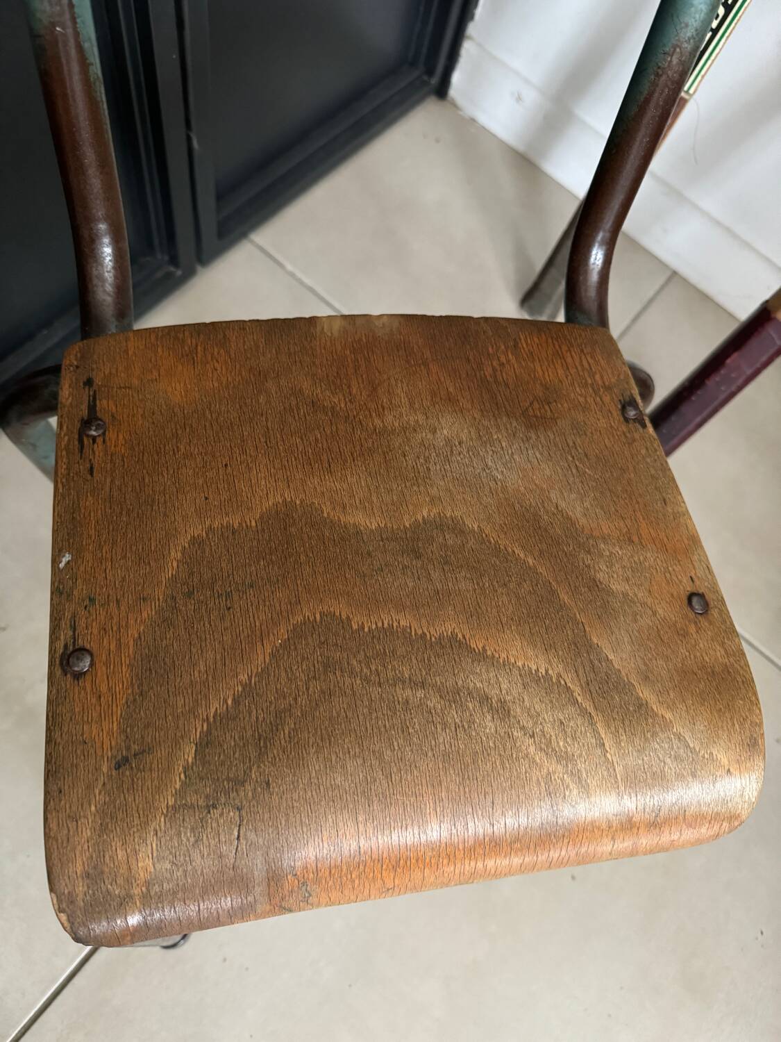 Old wooden and metal children's school chair