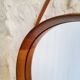 Round teak mirror by Uno and Osten Kristiansson for Luxus Vittsjö, Sweden.