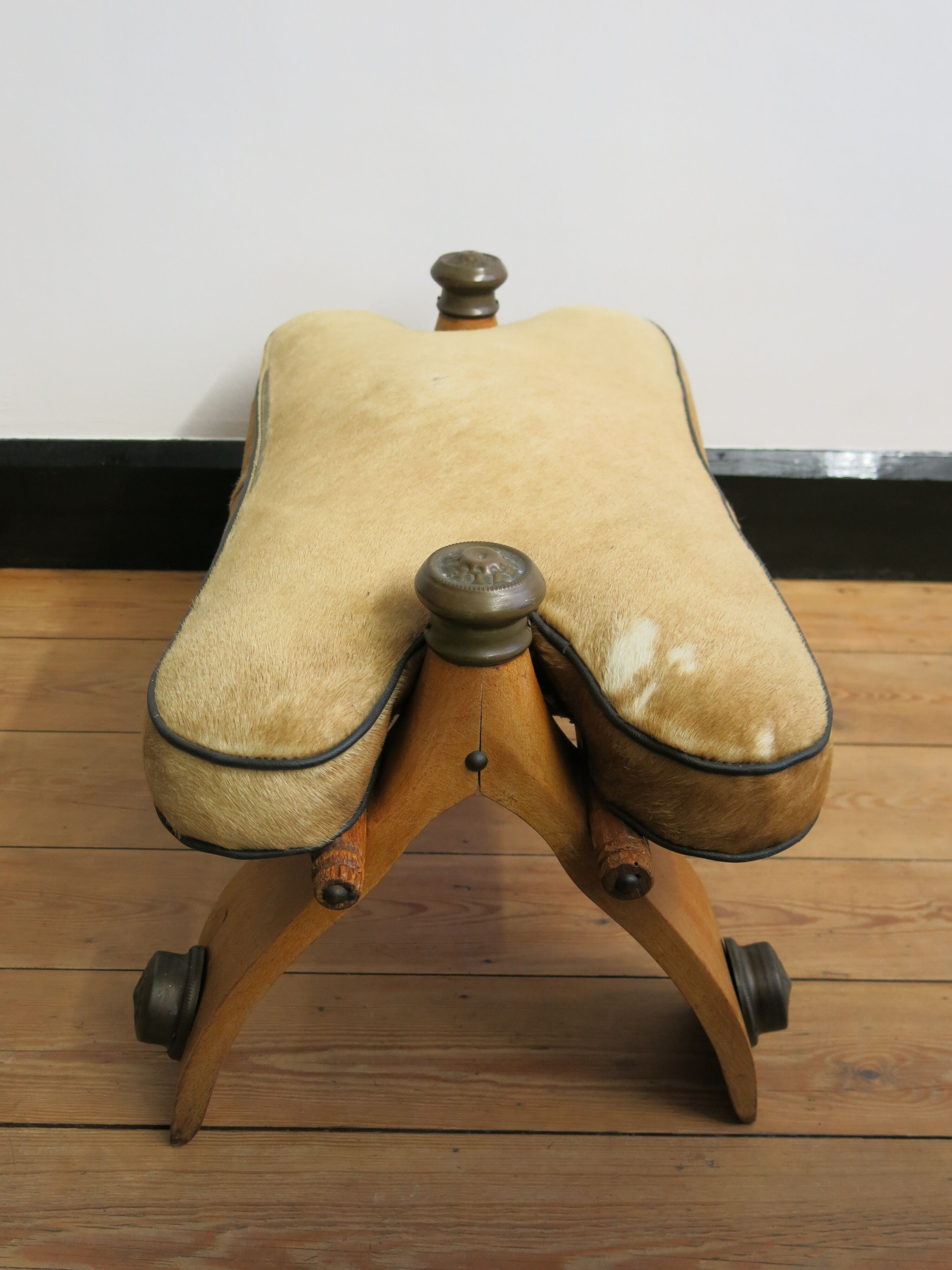 Camel saddle stool