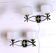 Pair of double wall sconces, Maison Arlus, Mid-Century, black brass opaline