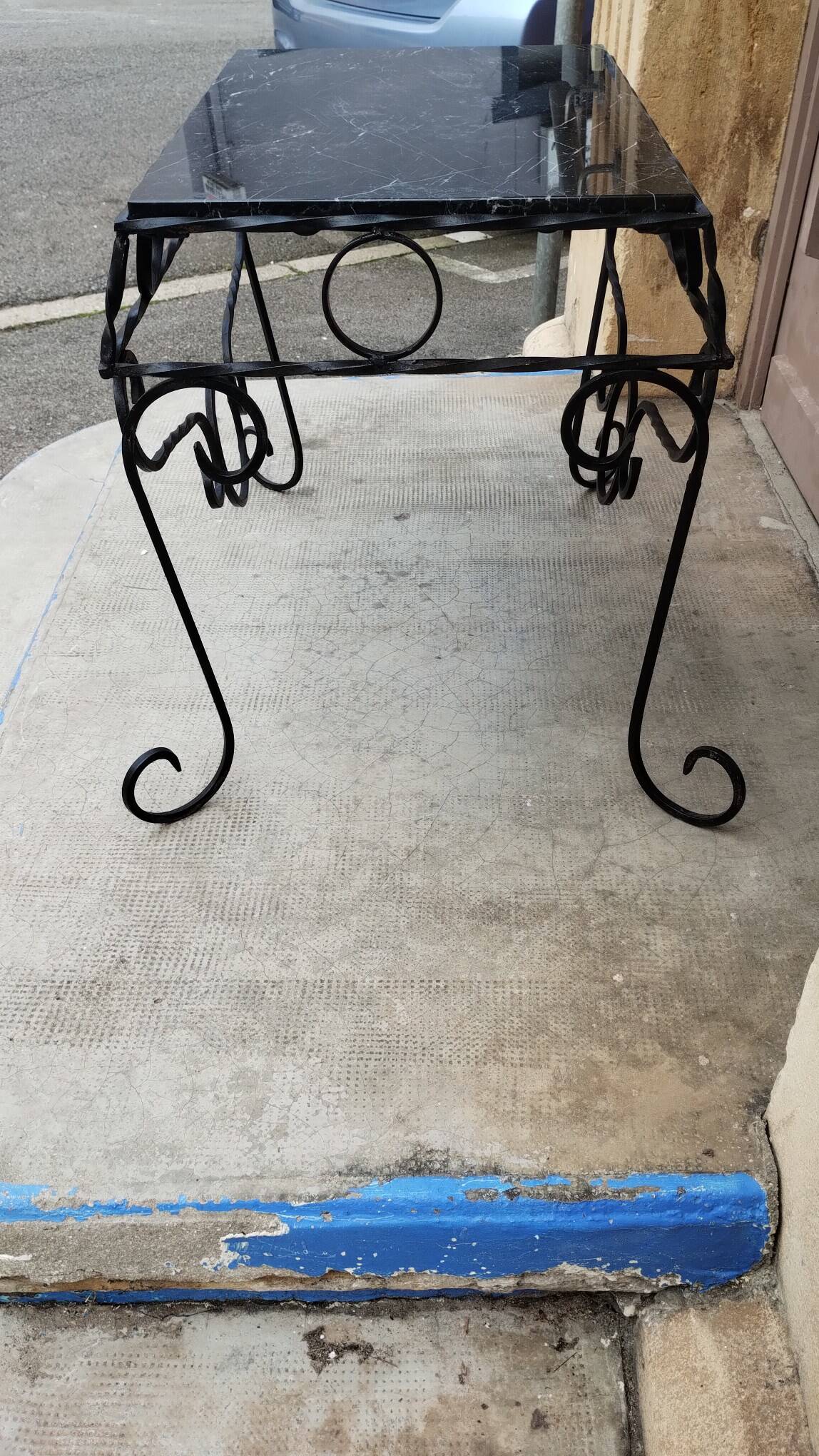 Wrought iron coffee table with black marble top