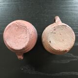 Pair of sandstone pitchers
