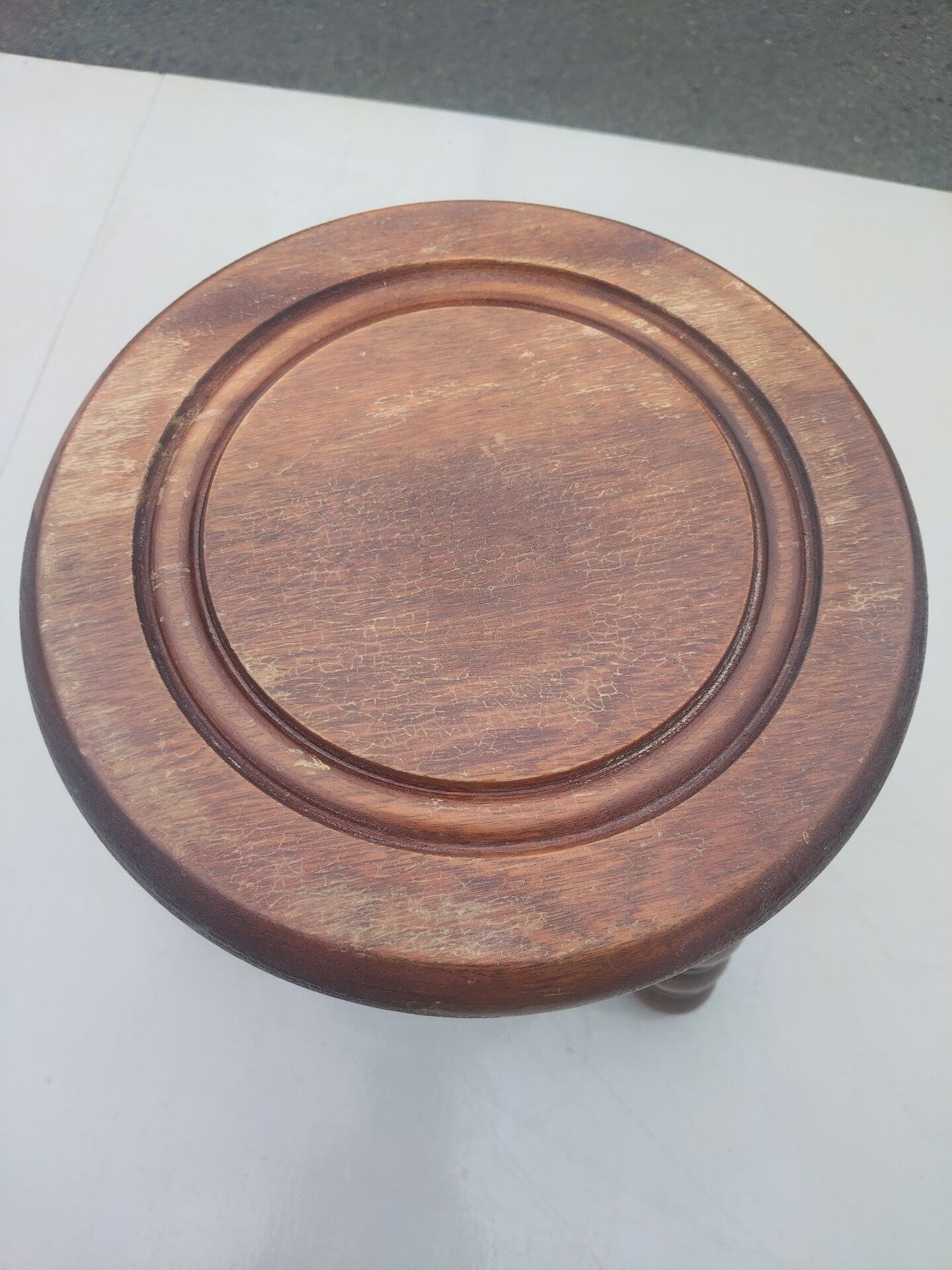 Small vintage tripod stool made of turned wood, in the style of Charles.