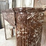 Red marble fireplace in the Louis XVI style, late 19th century