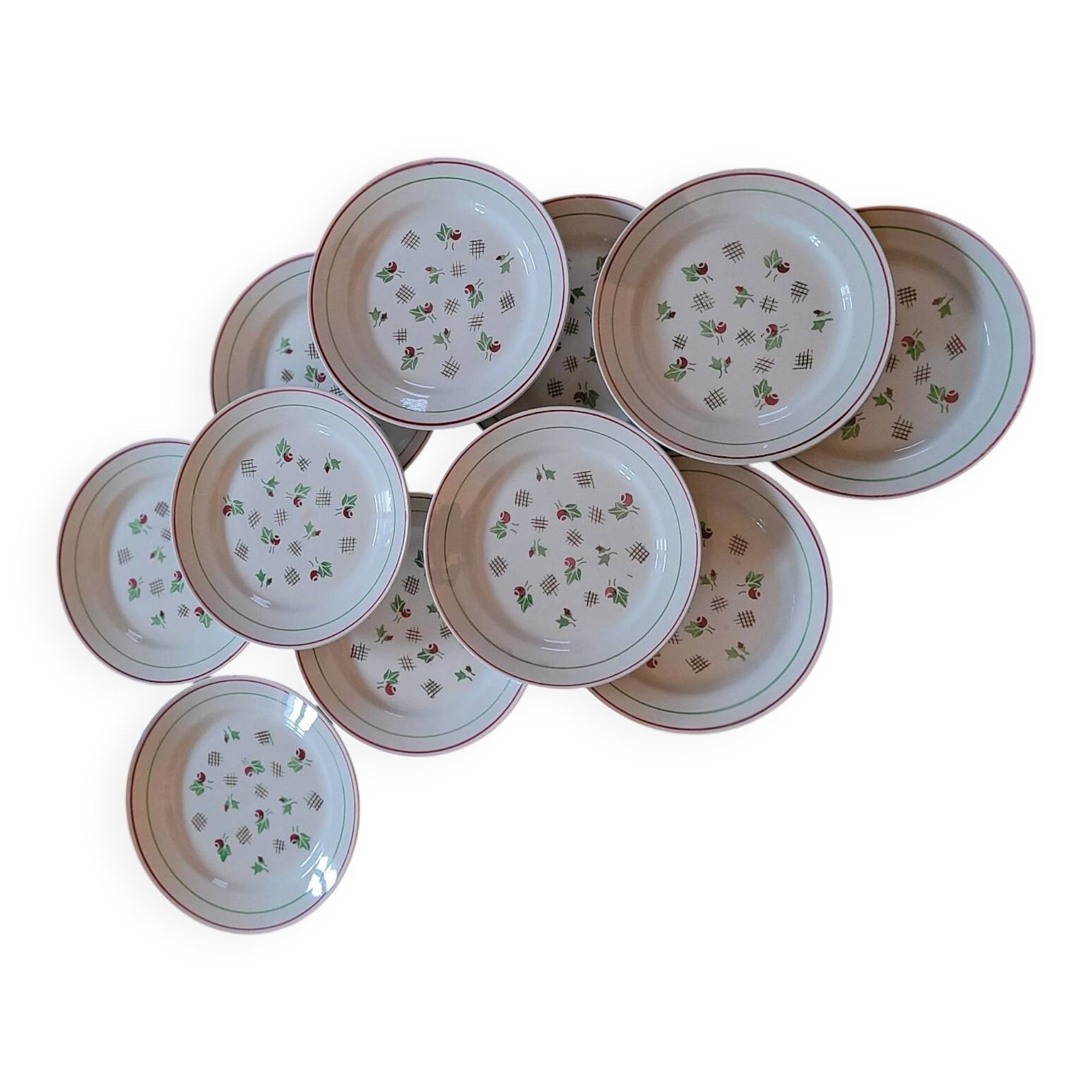 11 dinner plates decorated with stylized roses. 1950s. 11 dinner plates
