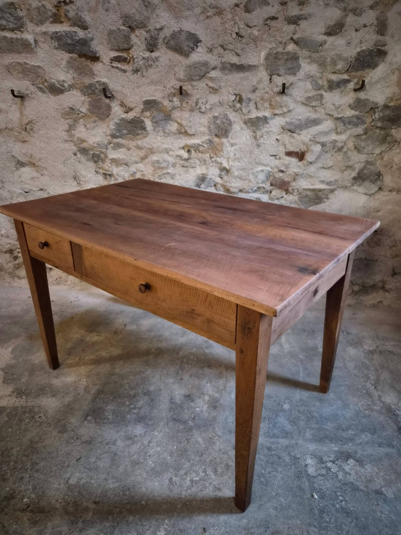 French antique dining table in cherry wood with two drawers, circa 1880–1920.