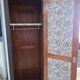 Man standing in wardrobe