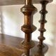Old shelf in turned wood like reels