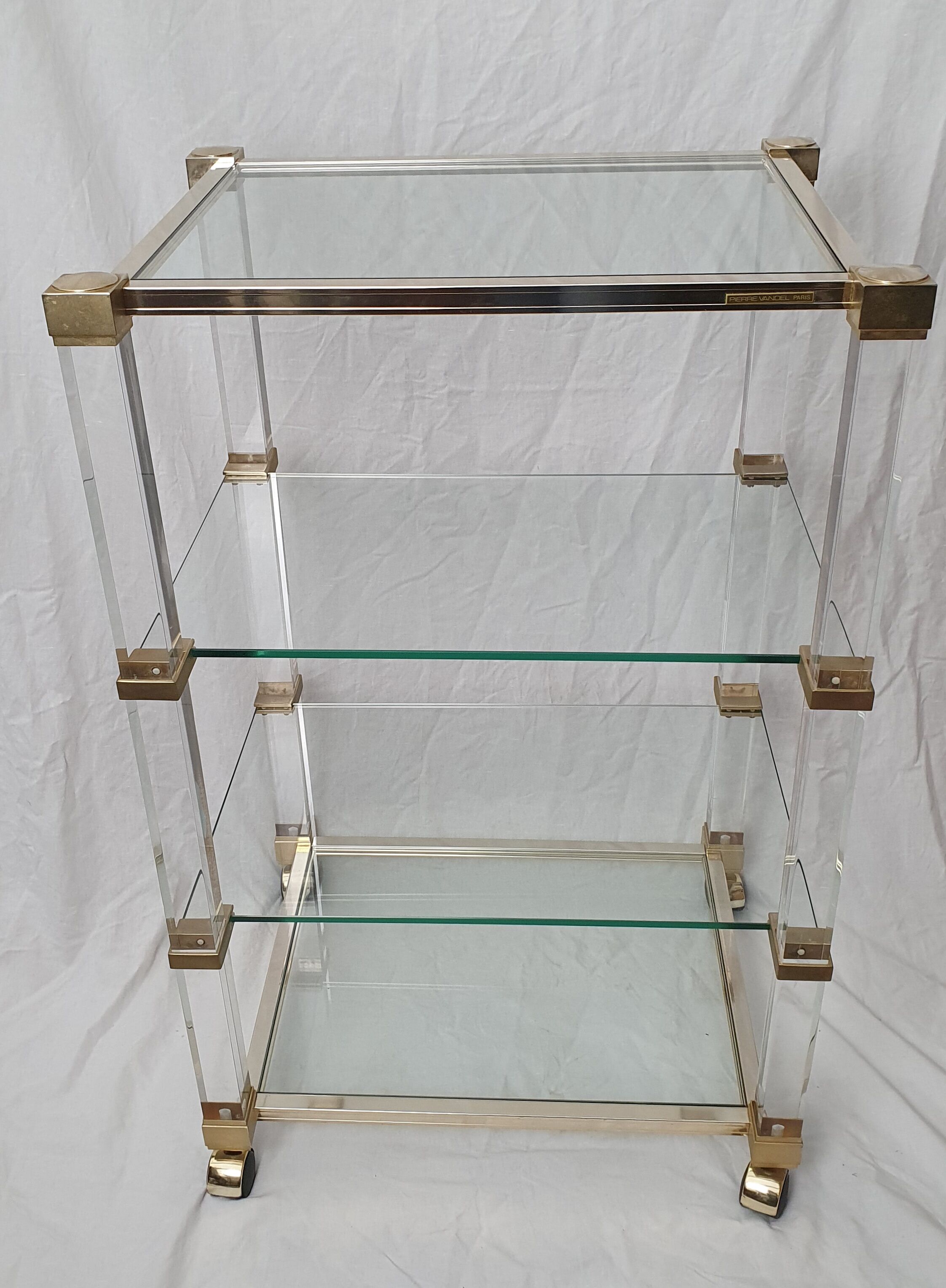 Rolling glass and plexiglass shelf by Pierre Vandel