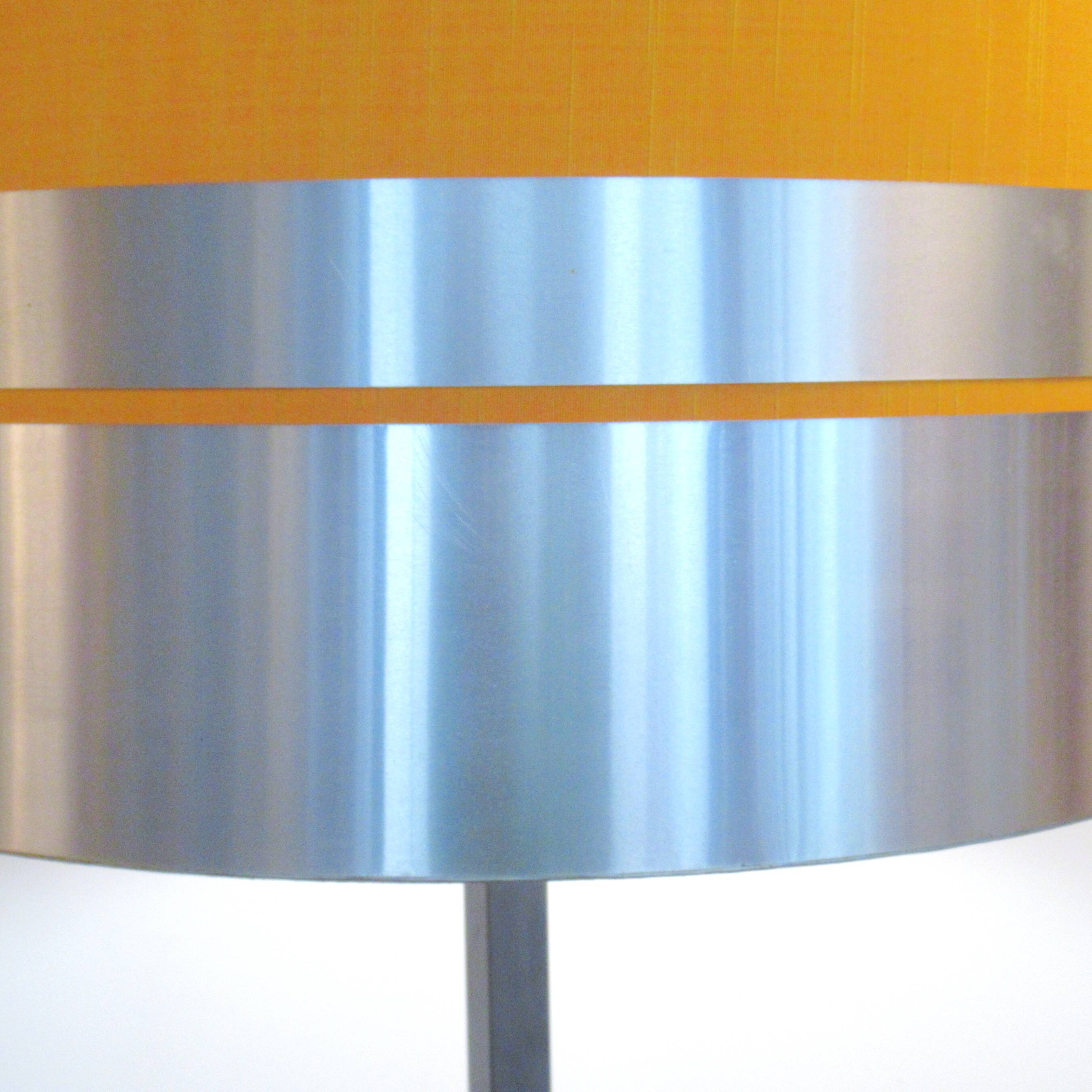 Floor lamp with a large orange shade and metal from the 1960s.