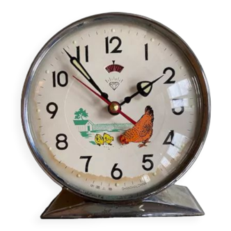 Vintage alarm clock with pecking hen, in perfect working order