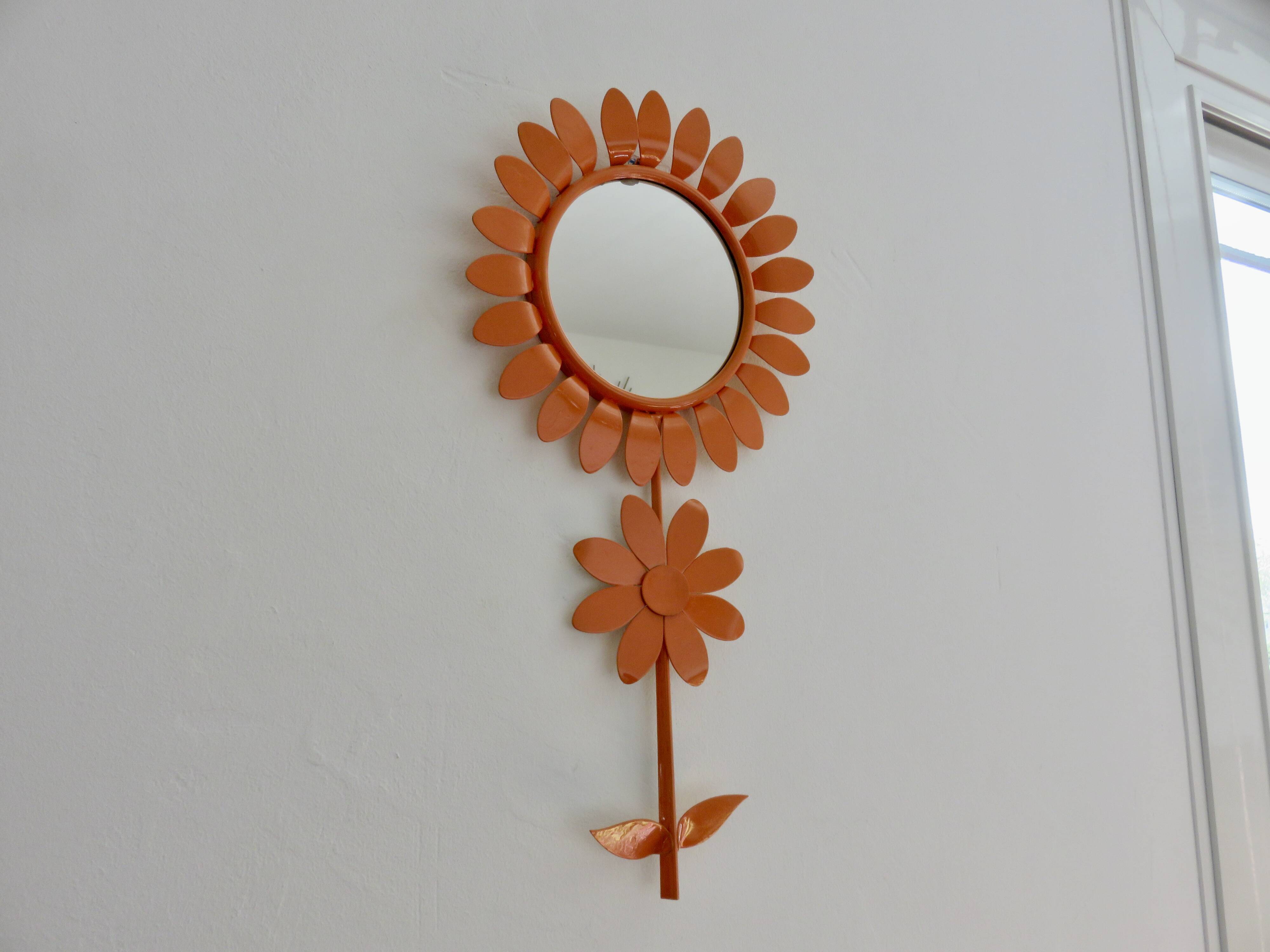 Large 1970s "flower" mirror in orange metal