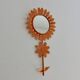 Grand miroir "fleur" 1970 en métal orange