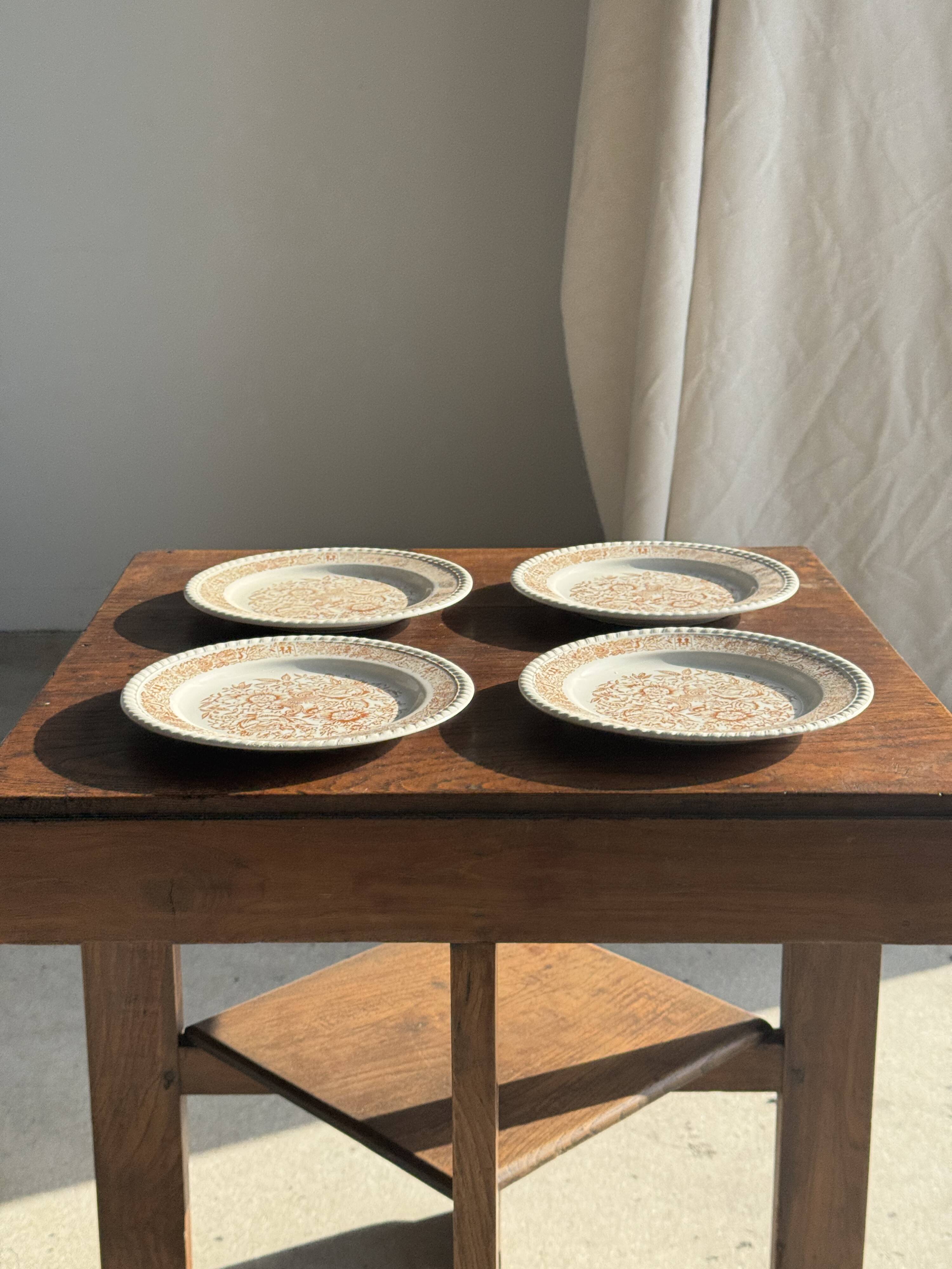 Set of 4 small dessert plates with a vintage stylised flower pattern.