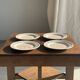 Set of 4 small dessert plates with a vintage stylised flower pattern.