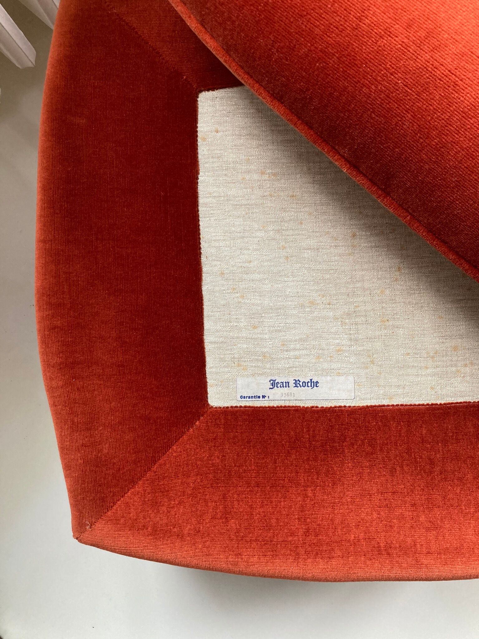 Vintage Jean Roche pouf in orange velvet with fringes