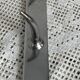 Stainless steel butcher's hook, known as a "wolf tooth bar."