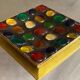 Square section cut glass and metal decorated with multicolored glass cabochons