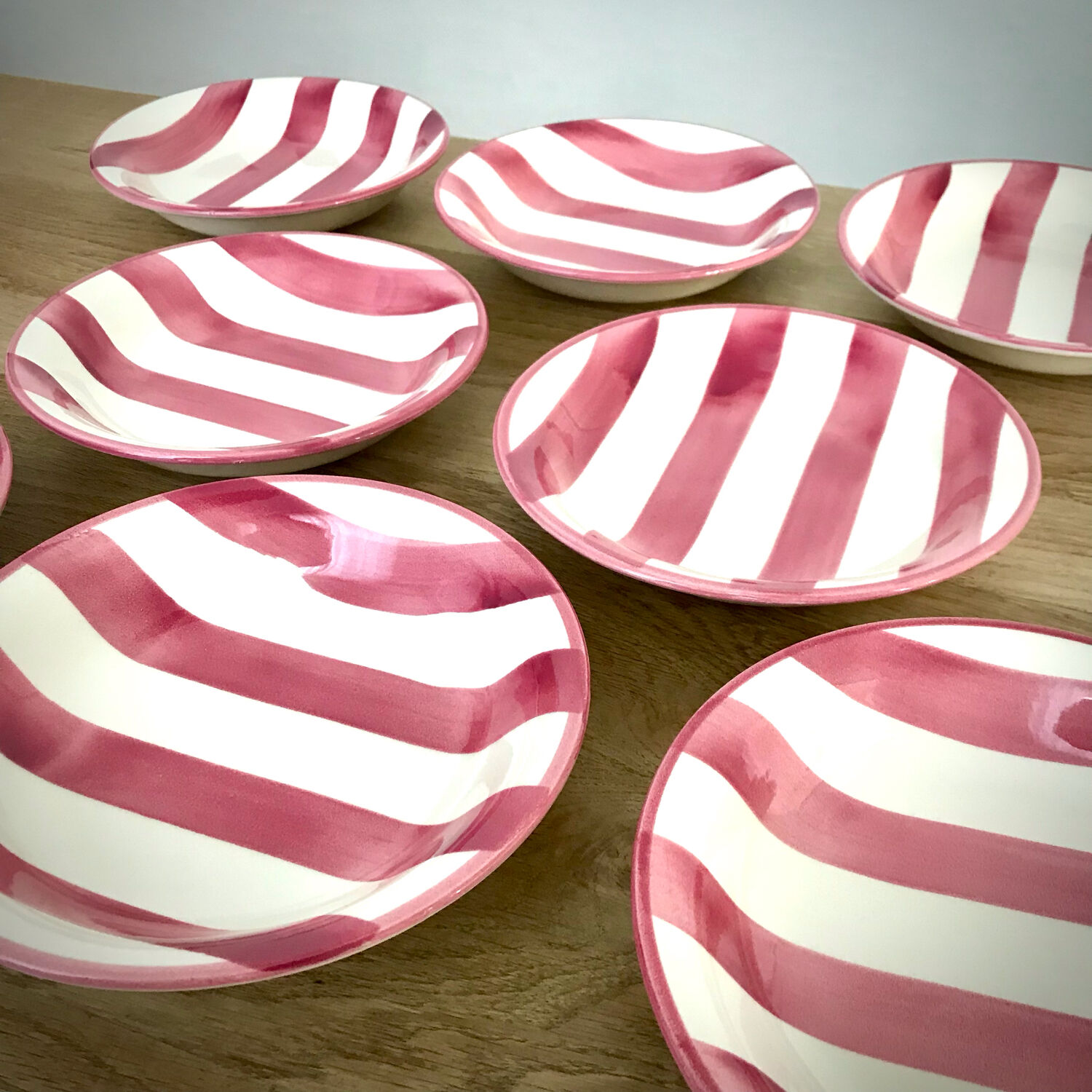 8 pink striped plates