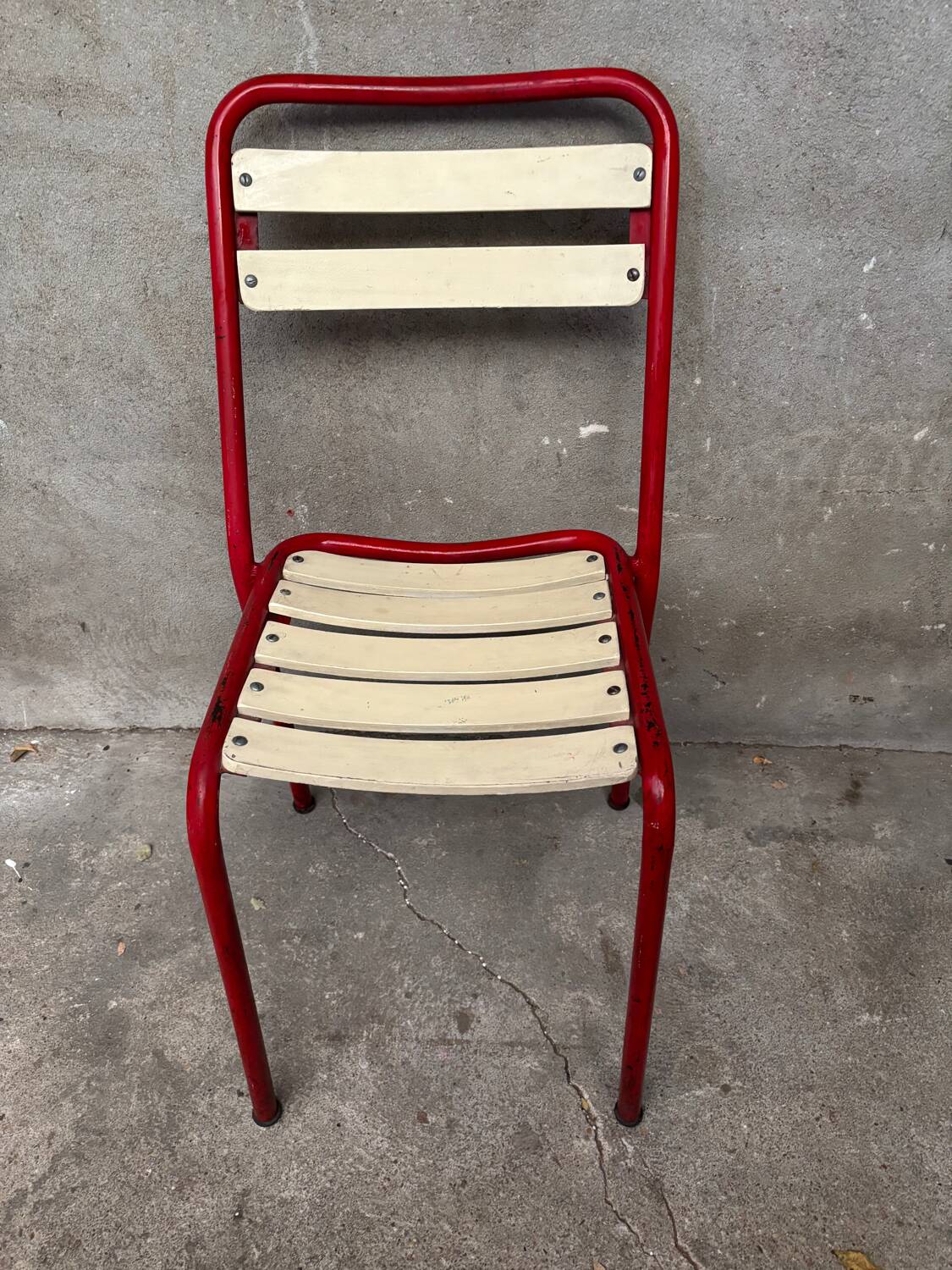 Red and white Tolix chair