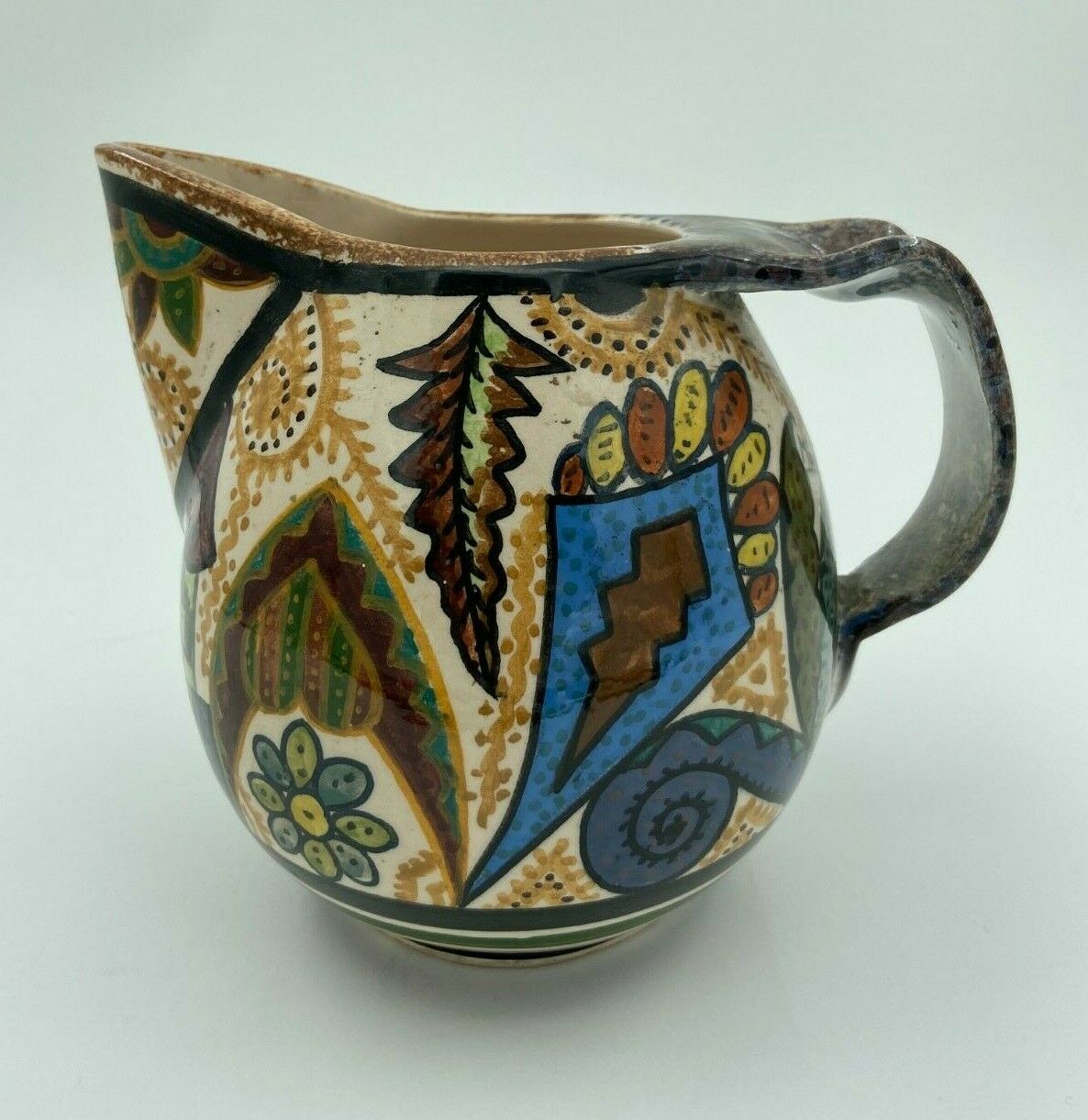 Pichet Paul Fouillen faience de Quimper decor geometrique signe