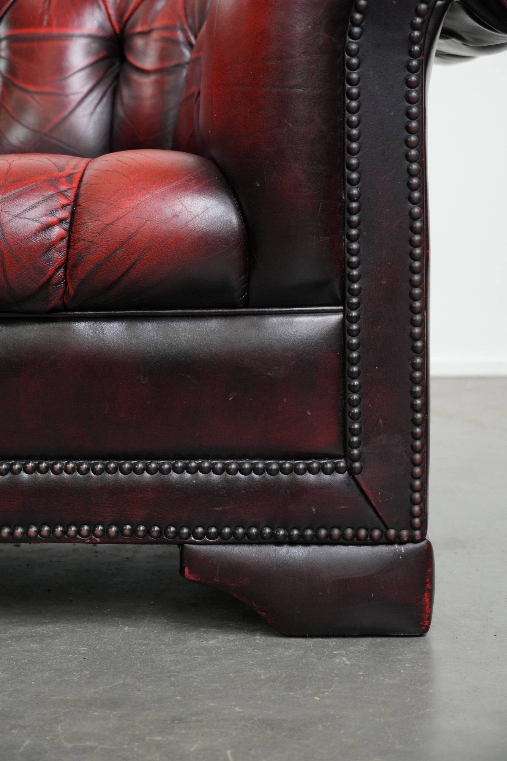 Classic cowhide Chesterfield button seat armchair in a beautiful red colour